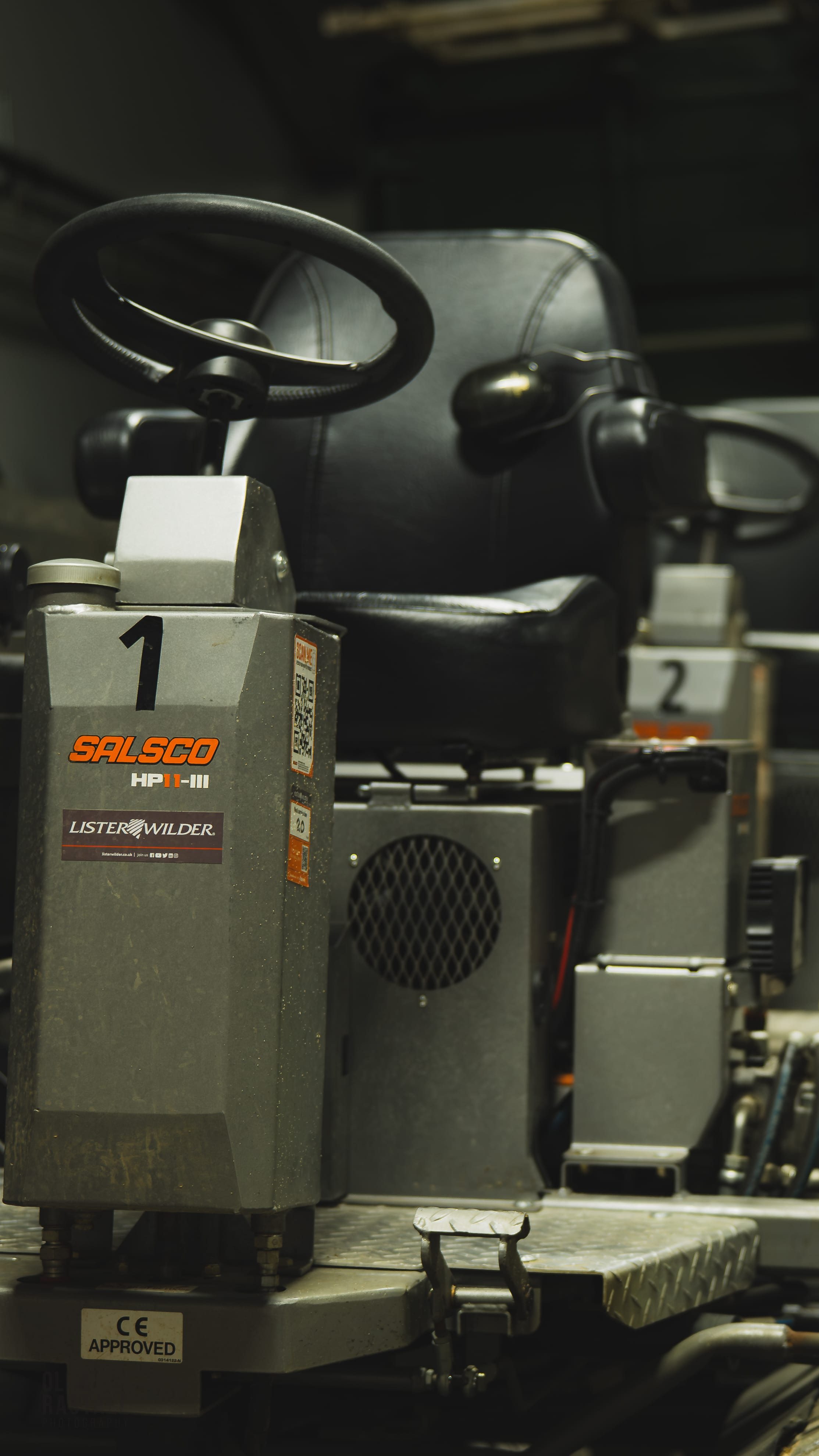 The control column of a Salsco HP11-III roller, Lister Wilder dealer plate below the badge